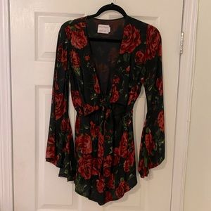 Long butterfly sleeve romper from Tiger Mist, black with roses, tie front